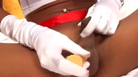 Tanned Ladyboy Nurse Teases With Her giant mounds And long dick